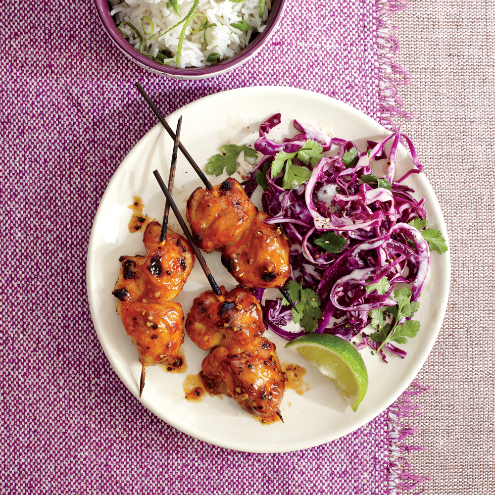 https://static.onecms.io/wp-content/uploads/sites/19/2015/03/23/pineapple-chicken-kebabs-cilantro-lime-slaw-ck.jpg