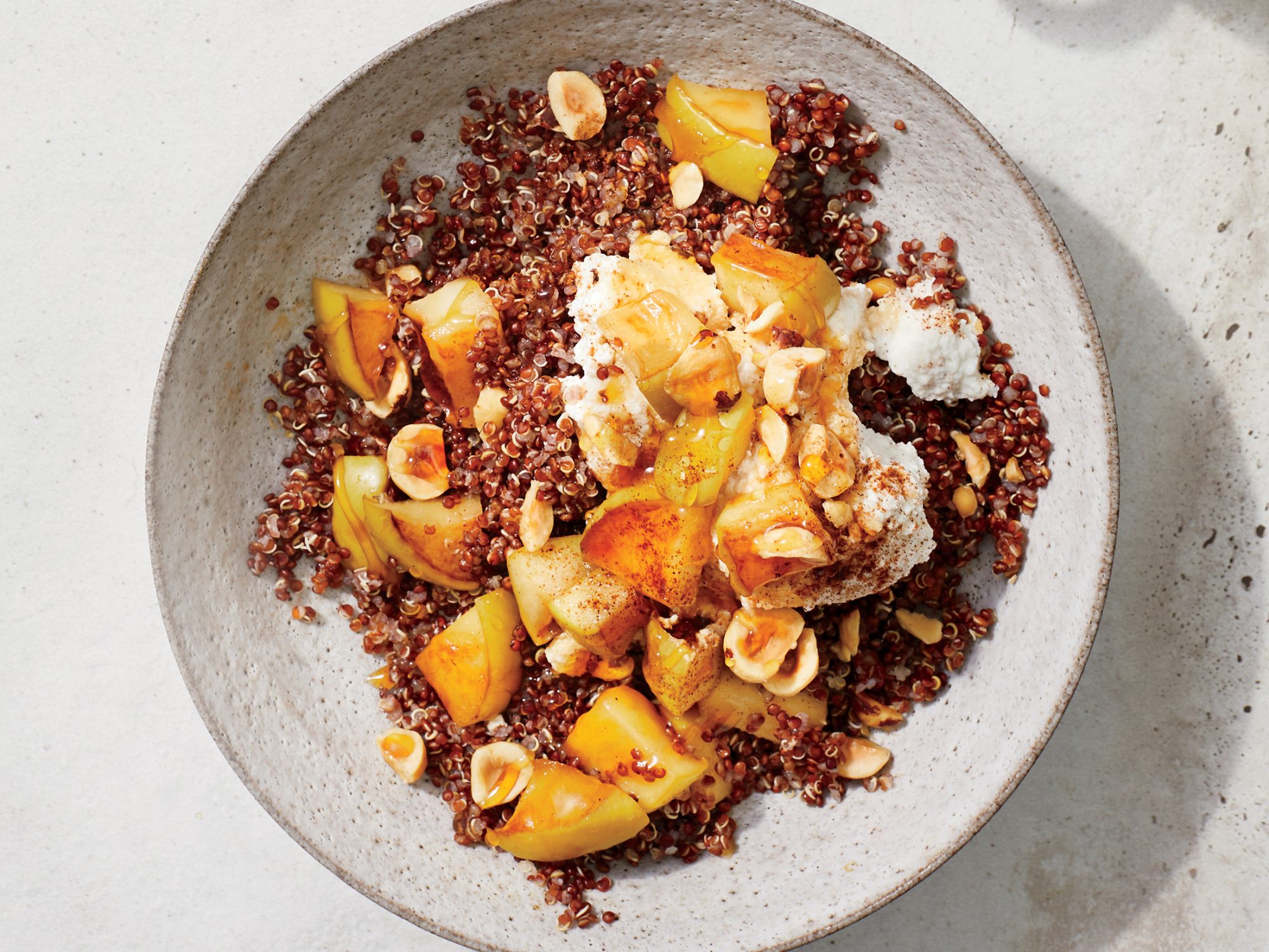 https://static.onecms.io/wp-content/uploads/sites/19/2019/02/19/apple-quinoa-bowl-with-cinnamon-ricotta-1809-p102-2000.jpg