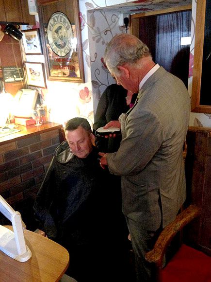 Princes Charles Gives Local Postman a Haircut