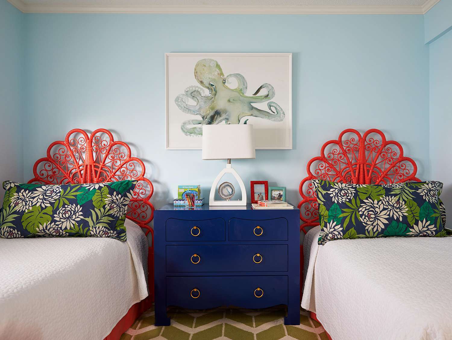 light blue bedroom with red frame twin beds fa9816b6